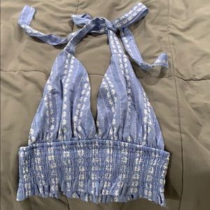 Light blue shirt ties at the top for an open back